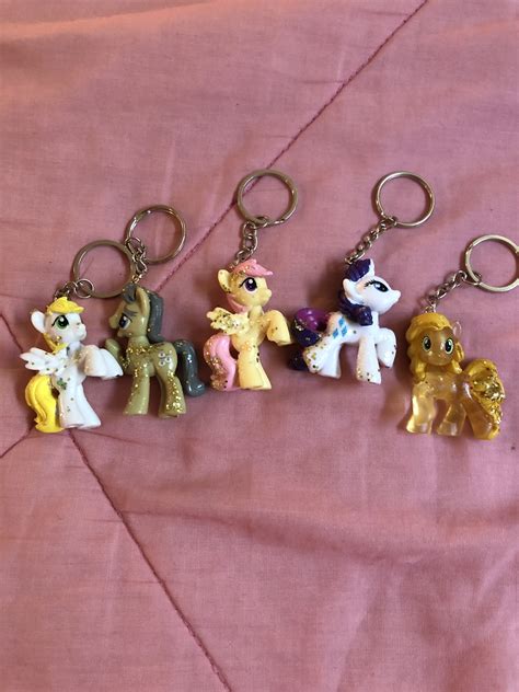 Keychains with mini pony figures and magical crystal accents